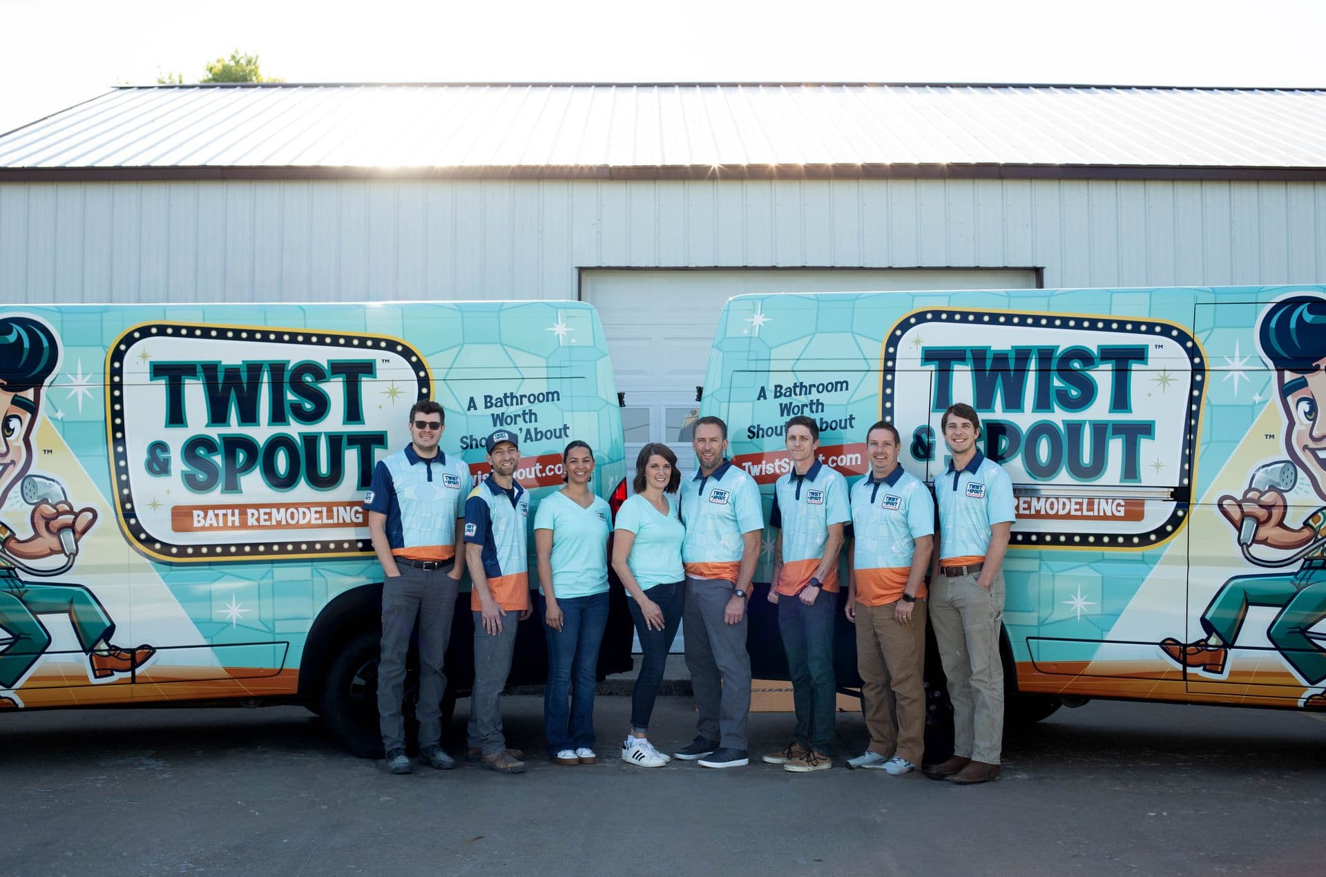 Twist & Spout Springdale bath remodeling crew in front of branded work vans